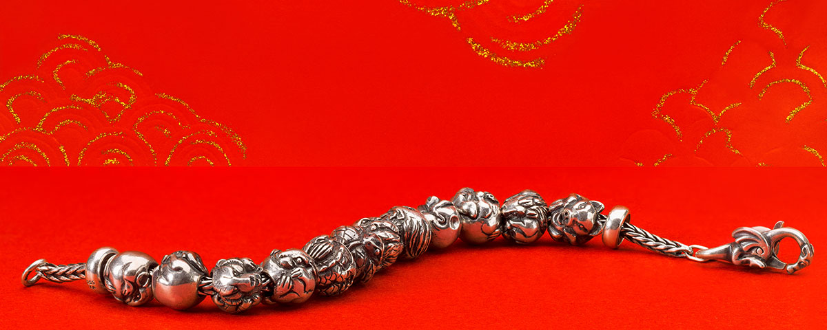 Chinese zodiac beads on a silver bracelet